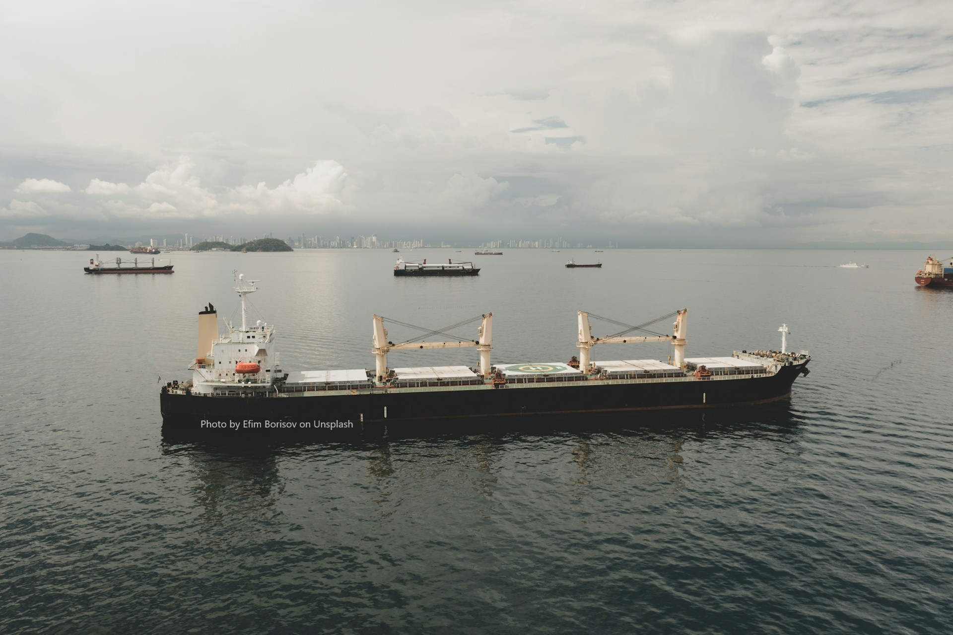 A large bulk carrier ship transporting dry bulk cargo such as coal, grain, or ore